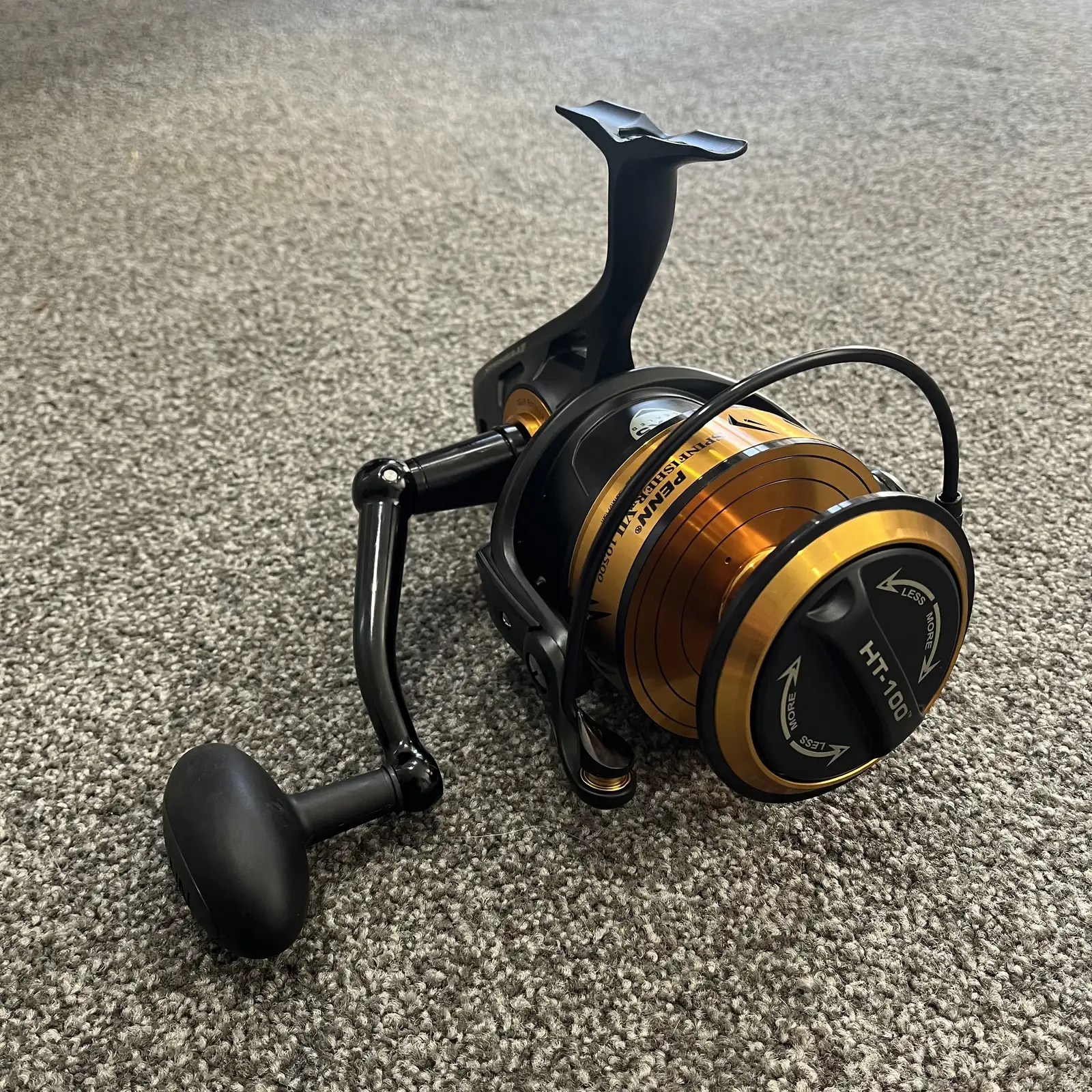 Penn Spinfisher VII 10500 spinning reel, black and gold, three-quarter view