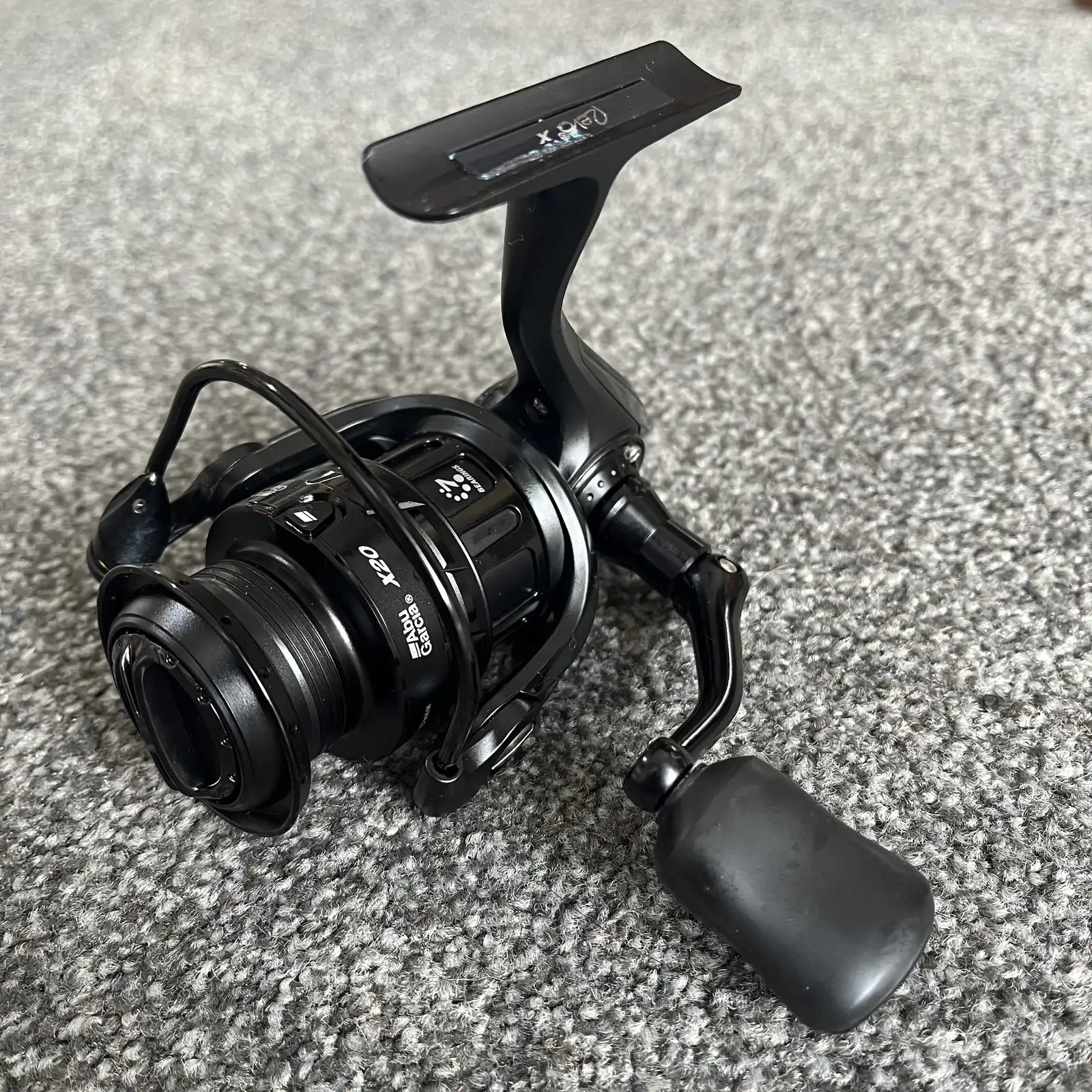 Abu Garcia Revo X 20 spinning reel, all black, three-quarter view