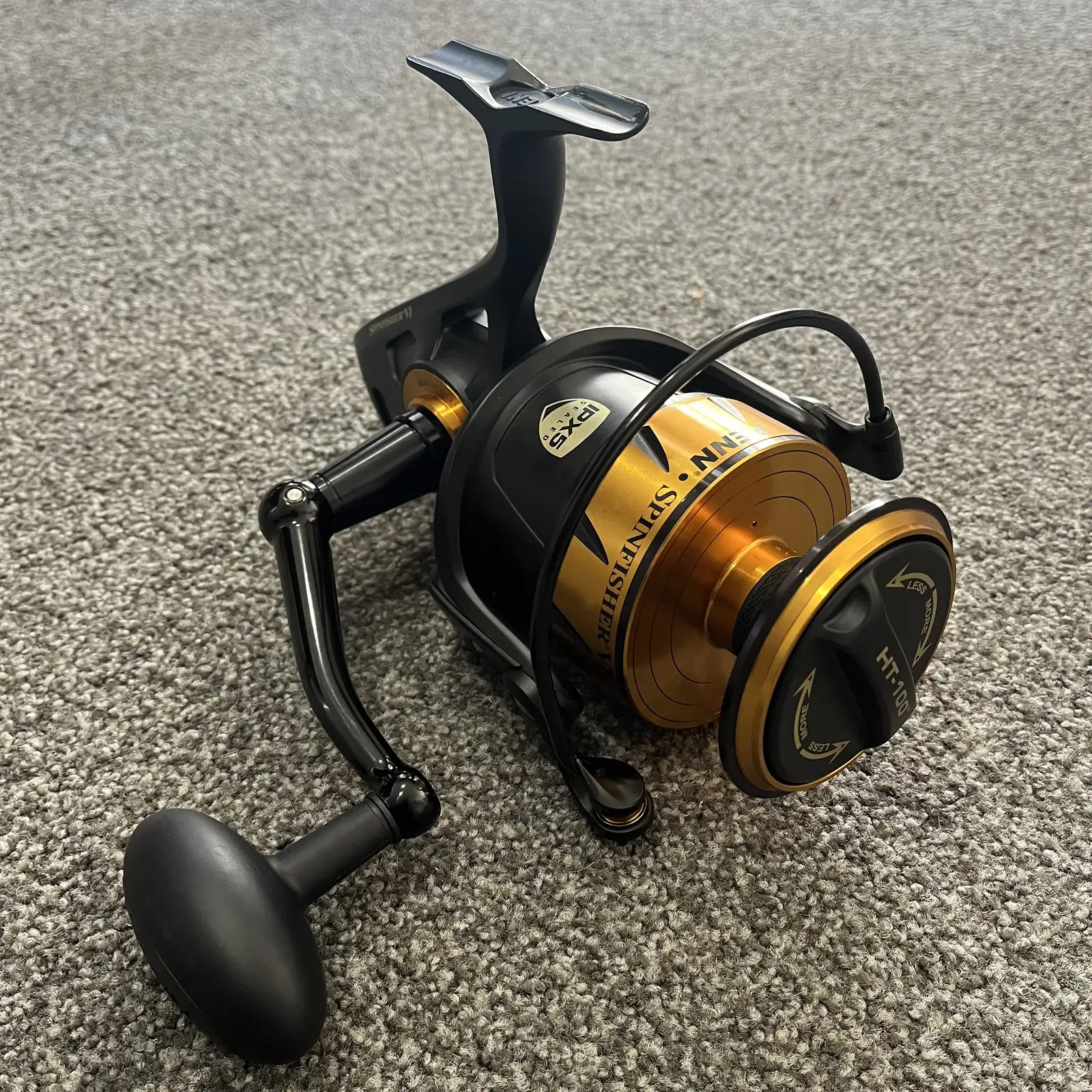 Penn Spinfisher VI 9500 spinning reel, black and gold, three-quarter view
