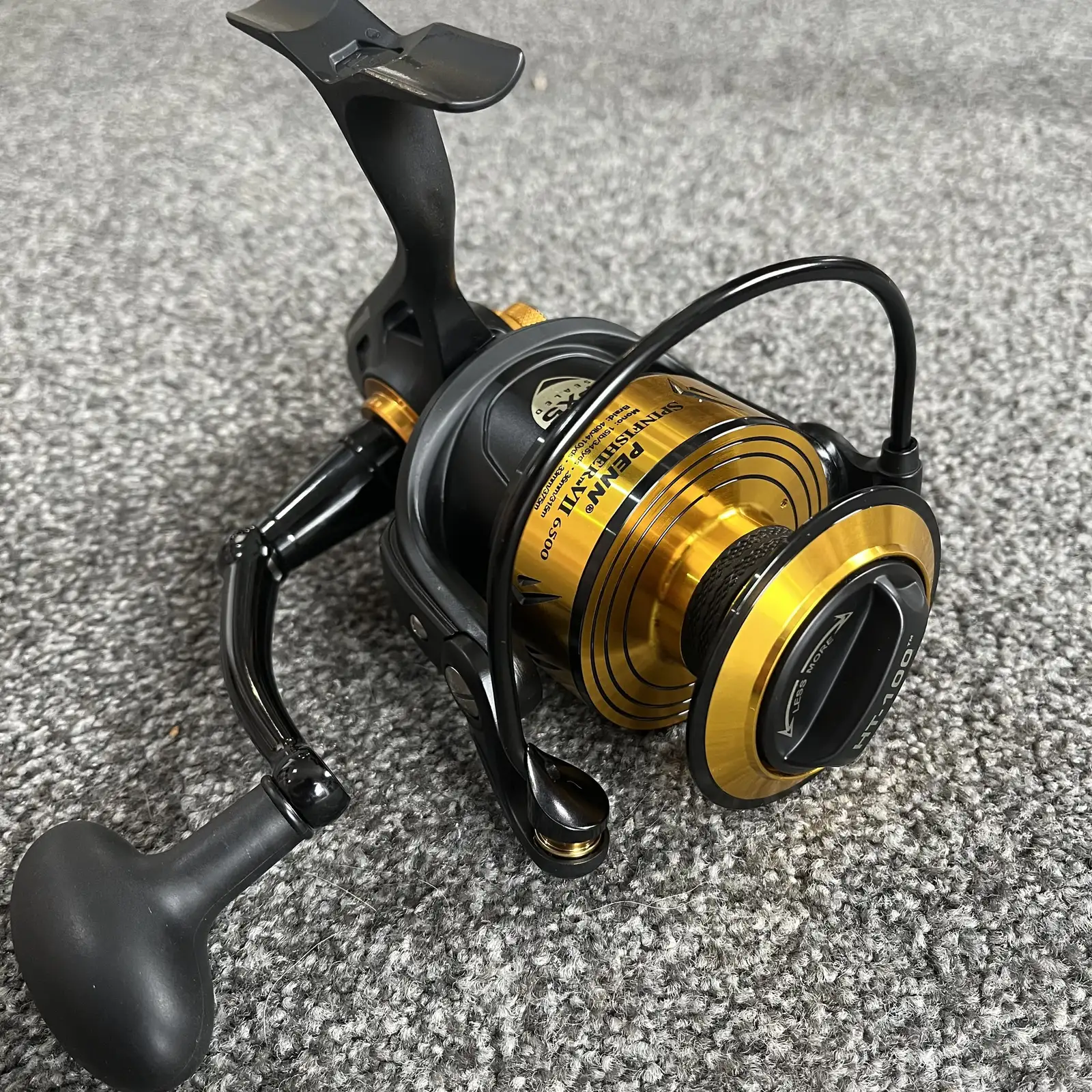 Penn Spinfisher VII 6500 spinning reel, black and gold, three-quarter view
