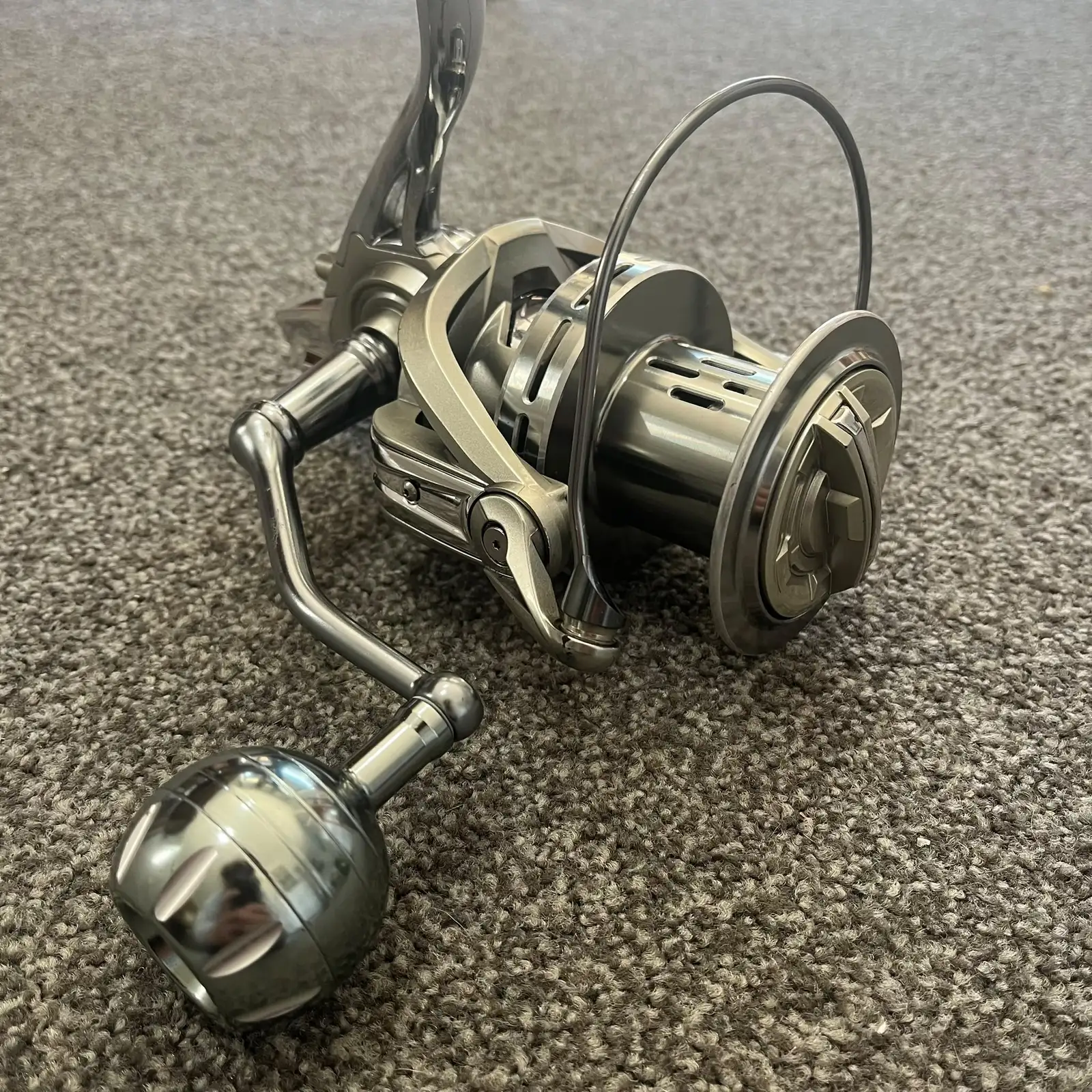 Used AS 14000 surf spinning reel, silver all-aluminium body, three-quarter view