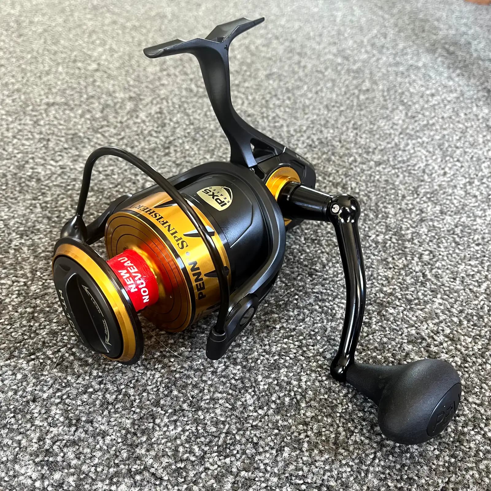 Penn Spinfisher VI 7500 spinning reel, black and gold, factory label on the spool